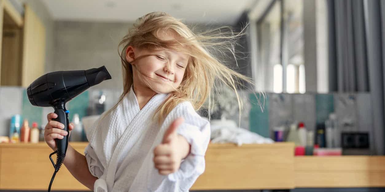 Cute girl closing her eyes in the bathroom GFCI Outlets are important for electrical safety